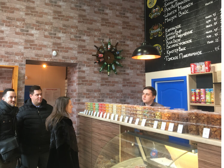 Team observing operations inside a beer boutique on the outskirts of St. Petersburg